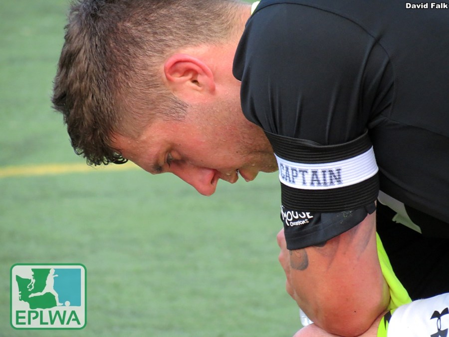 Leo Potts, still wearing his captian's armband, takes a breather after being subbed out in stoppage time. (David Falk)