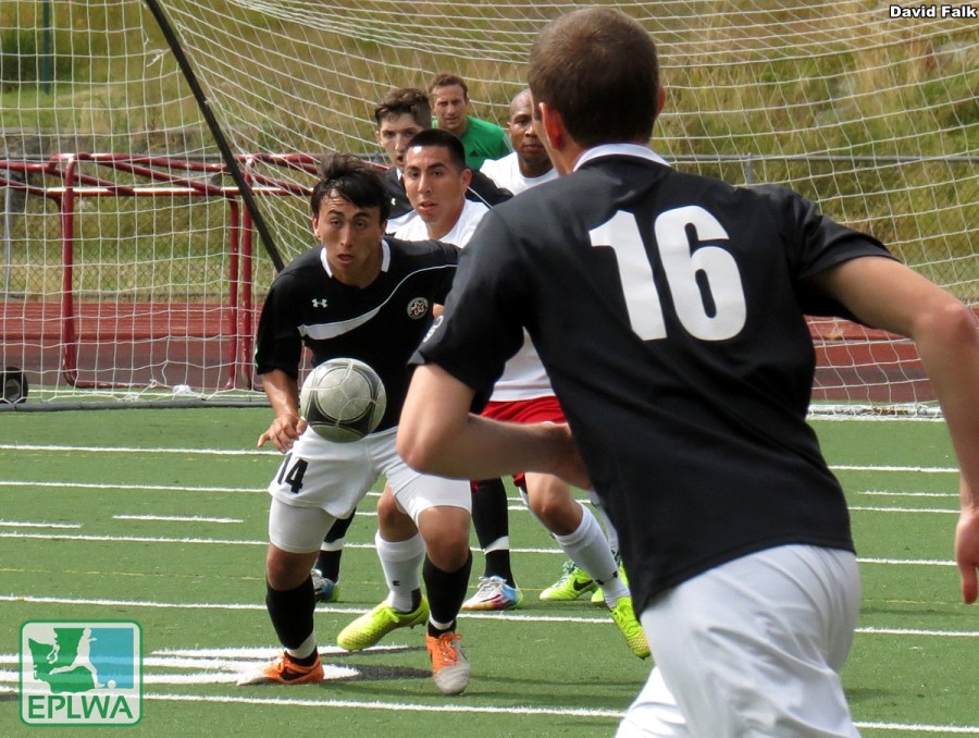 Izzy Deluna (left) eyes the incoming ball. He scored a brace to help the WestSound cause. (David Falk)