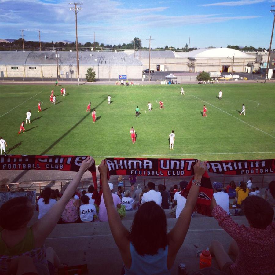 Hoppers supporters hold their scarves high. (Facebook)