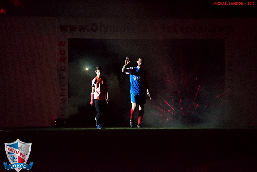 Olympic Force players are introduced with fog and flash indoors.